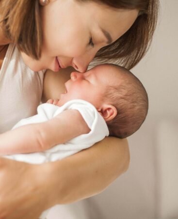 imgi_257_cute-newborn-baby-sleeping-mother-s-arms-motherhood-scaled